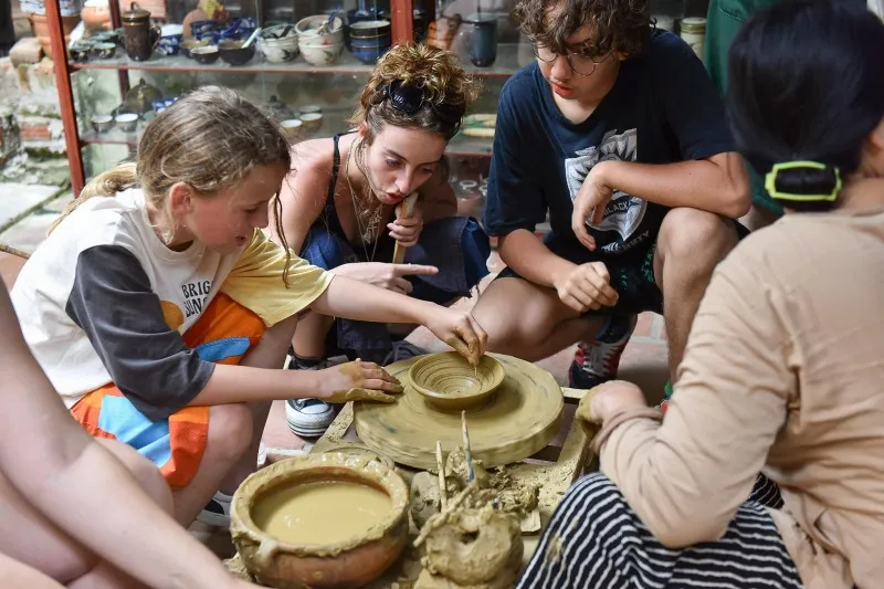 Traveler learning traditional weaving in Hoi An countryside